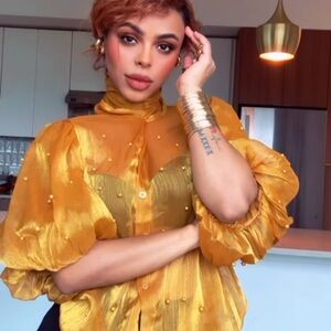 Gold Ruffled Blouse with Puff Sleeves and Bib Collar